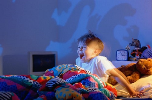 Boy-5-7-screaming-at-shadows-of-monsters-on-wall
