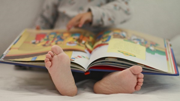 Baby reading a book